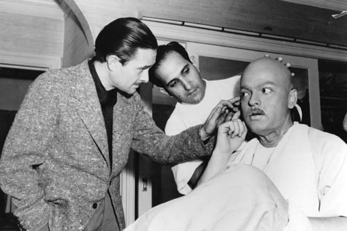 Gregg Toland (left) checks out Welles as he is transformed into Kane as an old man by make-up artist Maurice Seiderman.